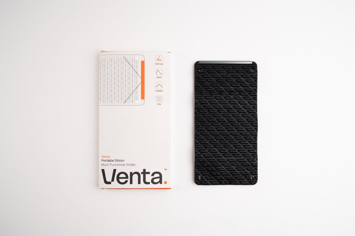 Venta Portable Silicone Holder in Black beside its box